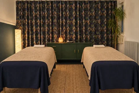 Both massage couches and the room around them in the Couples Suite